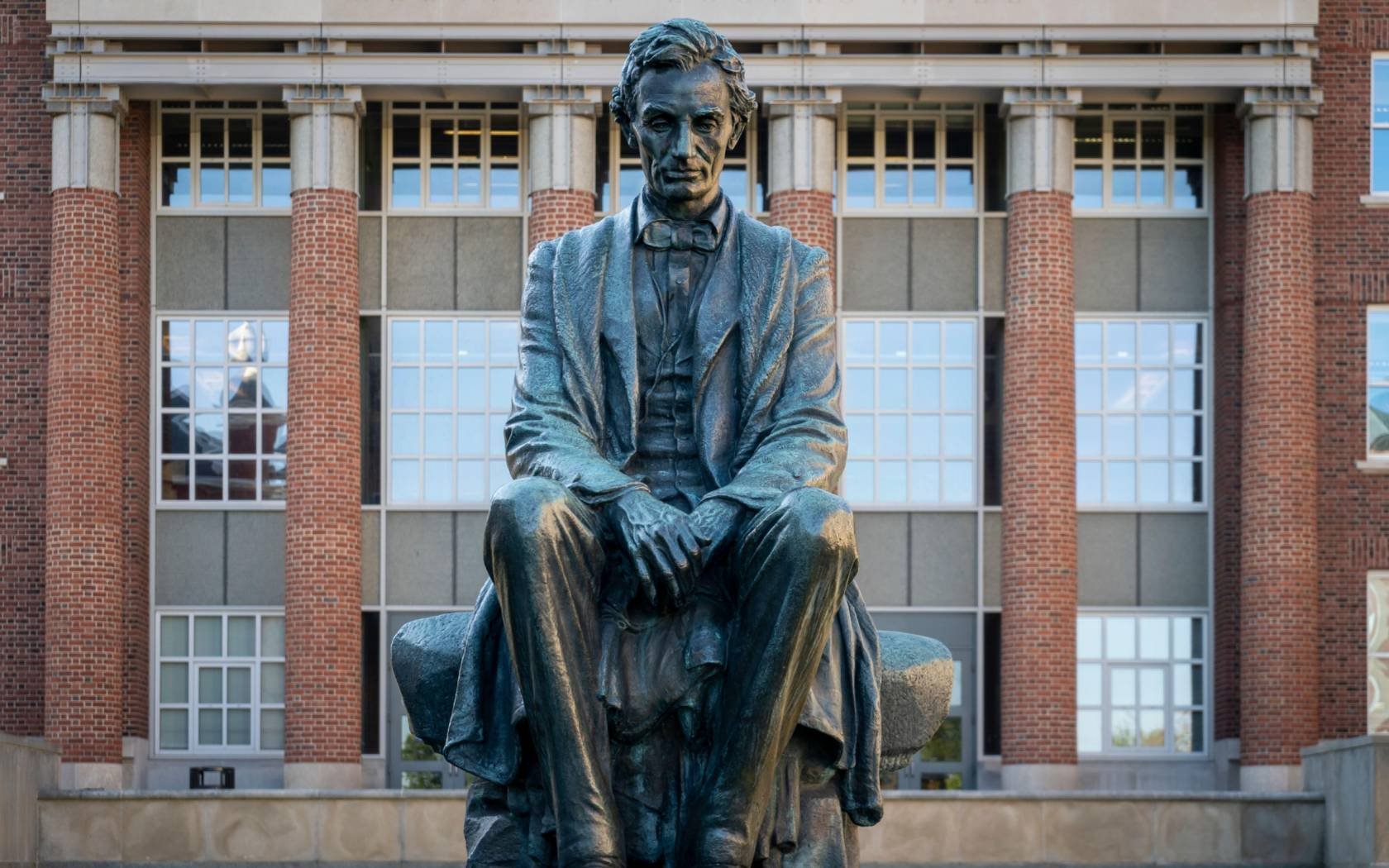 A statue of a young Abraham Lincoln sits in a courtyard on the campus of Syracuse University in Syracuse, New York.
