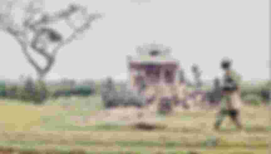 An American soldier passes the ruins of a temple in Hue, Vietnam, 1968. Credit: Bettmann Archive / Getty Images.