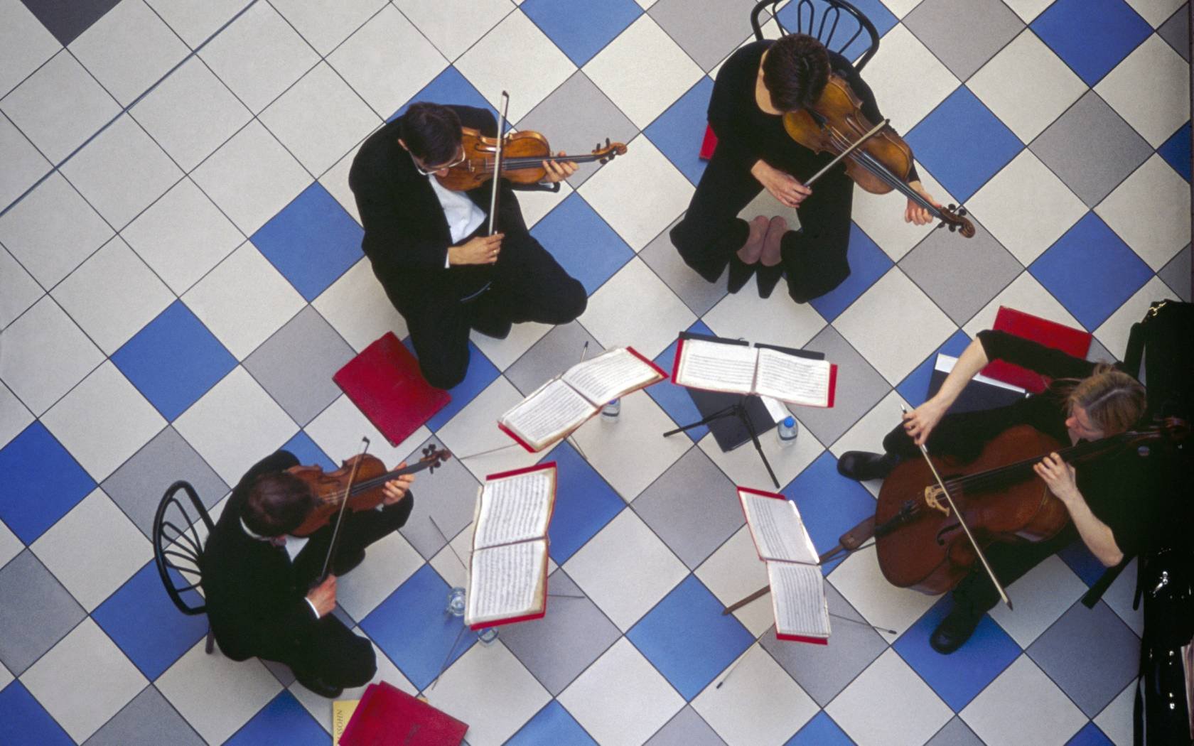 String quartet playing in the Saint Nicholas Shopping centre, London.