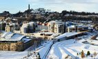 The Scottish Parliament building in the snow from Salisbury Crags, Edinburgh.