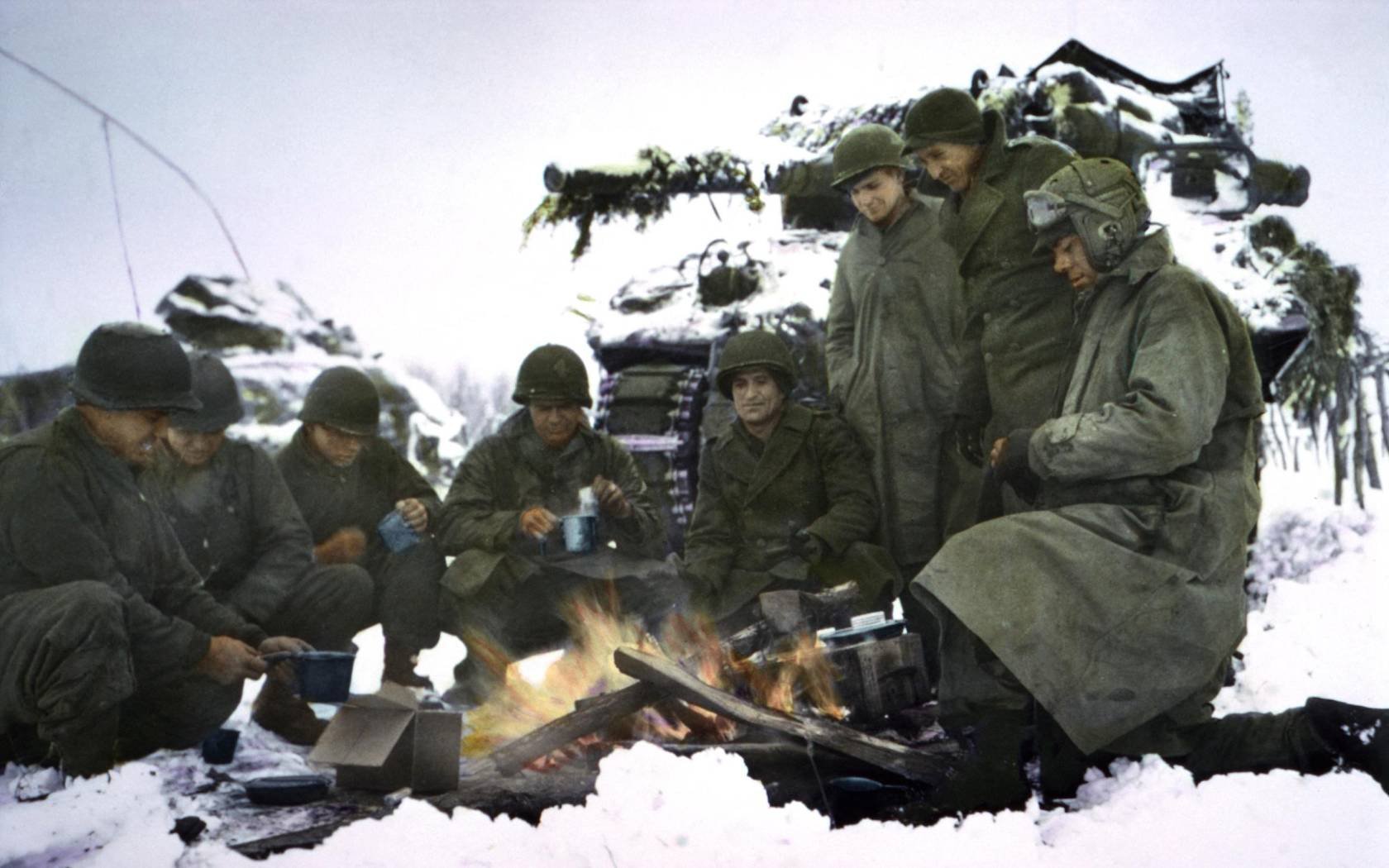 American tank crews keeping warm during the Ardennes-Alsace Campaign, Battle of the Bulge, 1945.