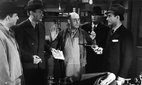A scene from the film 'Appointment in Berlin' (1943), starring George Sanders.