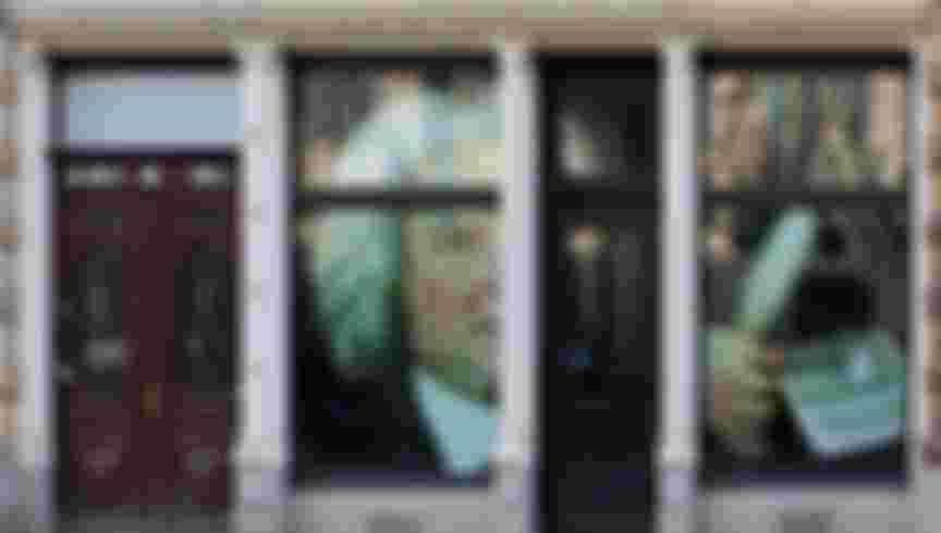 Painted shopping windows in front of Thomaskirche Church, Leipzig.