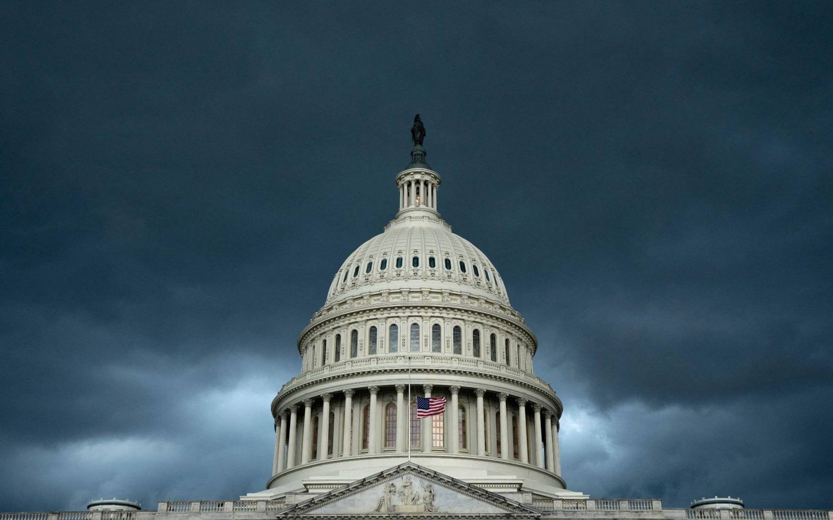 A storm rolls in over the Capitol Building in Washington, DC.