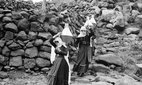 Druze women carrying water in Jabal al-Druze, Syria.