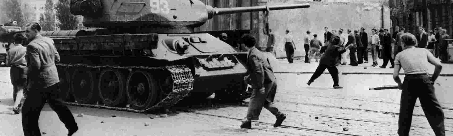 Demonstrators throw stones at Soviet tanks in Berlin during the East German uprising of June 17 1953.