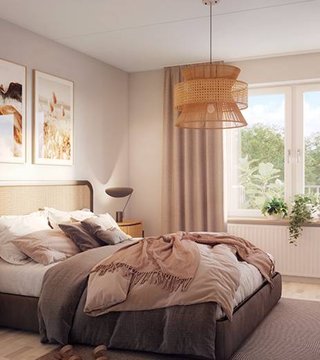 Ljusa sovrum med grönska utanför fönstret</br></br>