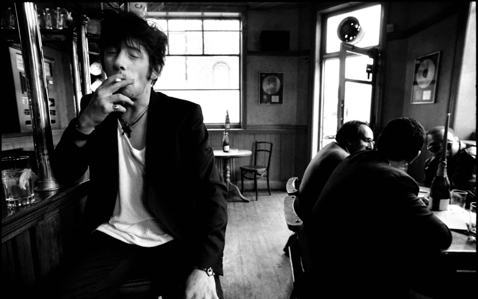 The legendary Irish rockstar Shane MacGowan pictured drinking and smoking at his favourite London pub Filthy MacNasty’s.