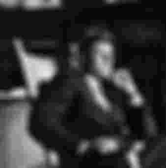 John F. Kennedy sitting in his signature rocking chair in the Oval Office. Creidt: © CORBIS/Corbis via Getty Images.