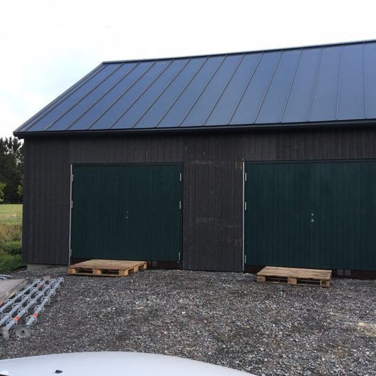Black and brown with green double door garage