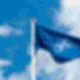 NATO flag waving in the wind.