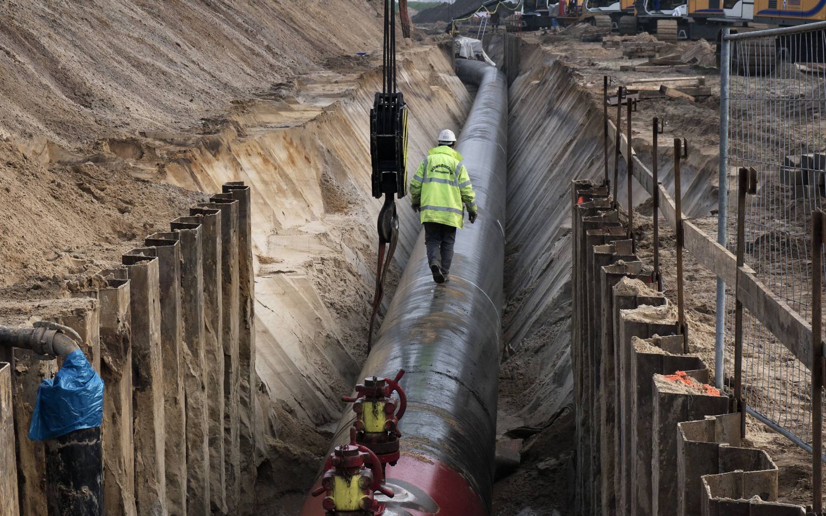 Worker balances on a gas pipeline connecting with the Nord Stream Pipeline between Russia and Western Europe