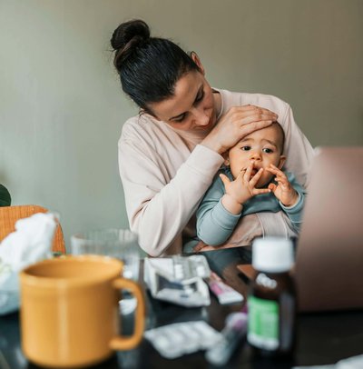 Mother taking care of sick son at home