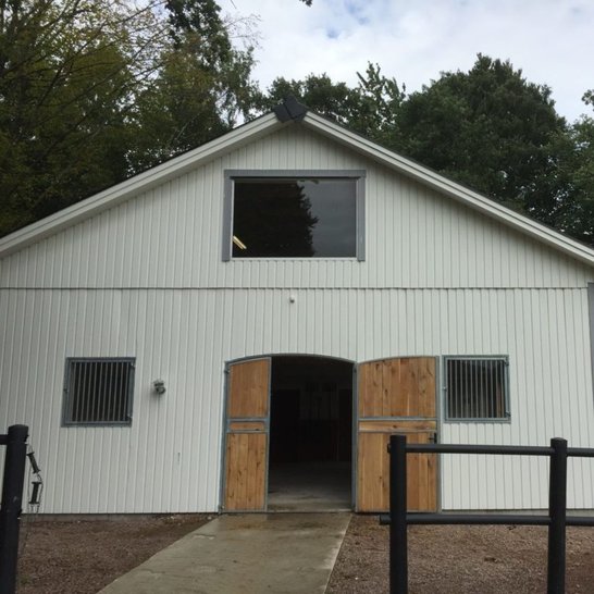 Double height barn with large top window