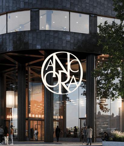 Fasadvy av kontorshuset Ancora med monogram.