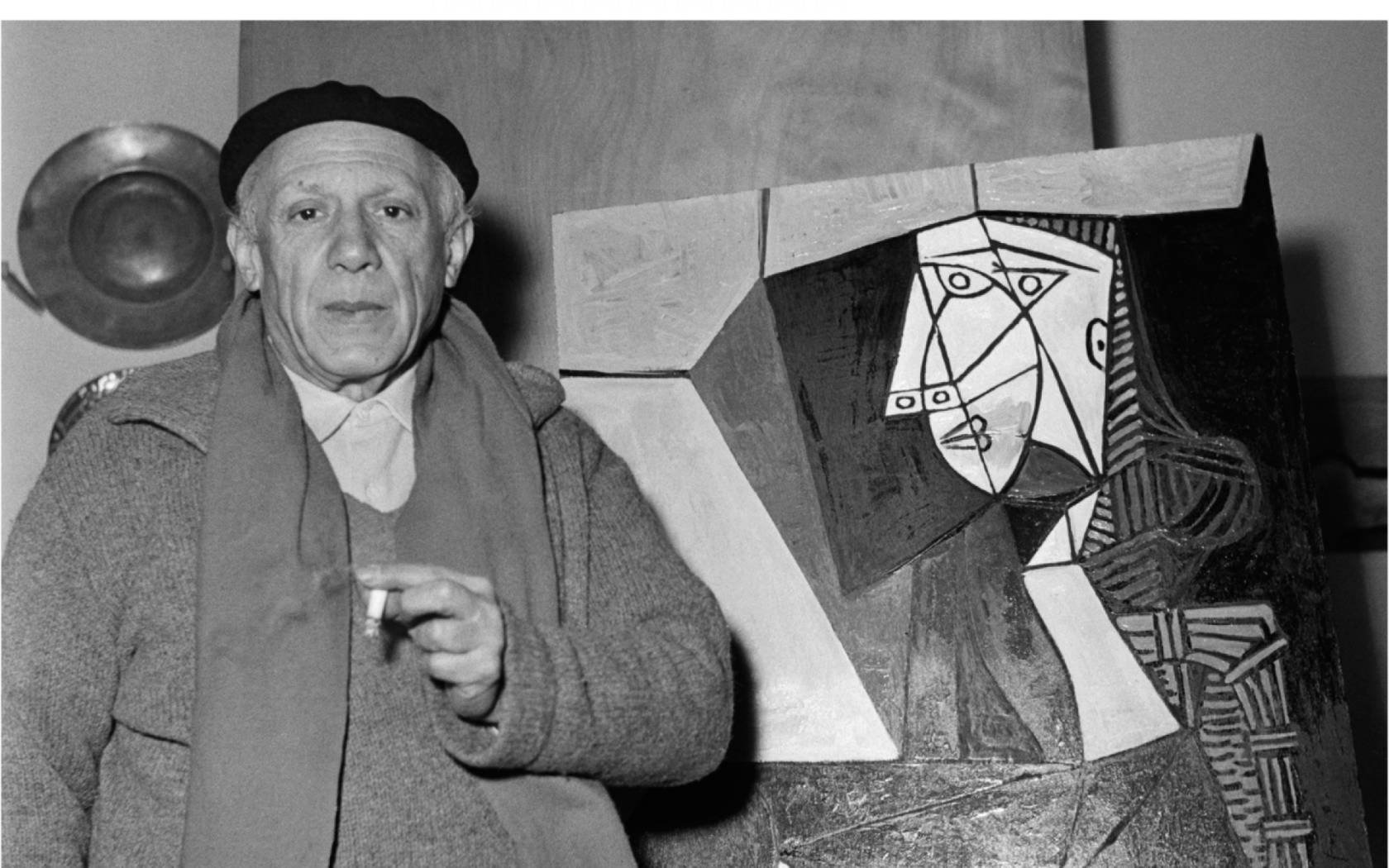 Picasso, a close friend and aesthetic confidante of Princet, with one of his Cubist masterpieces.