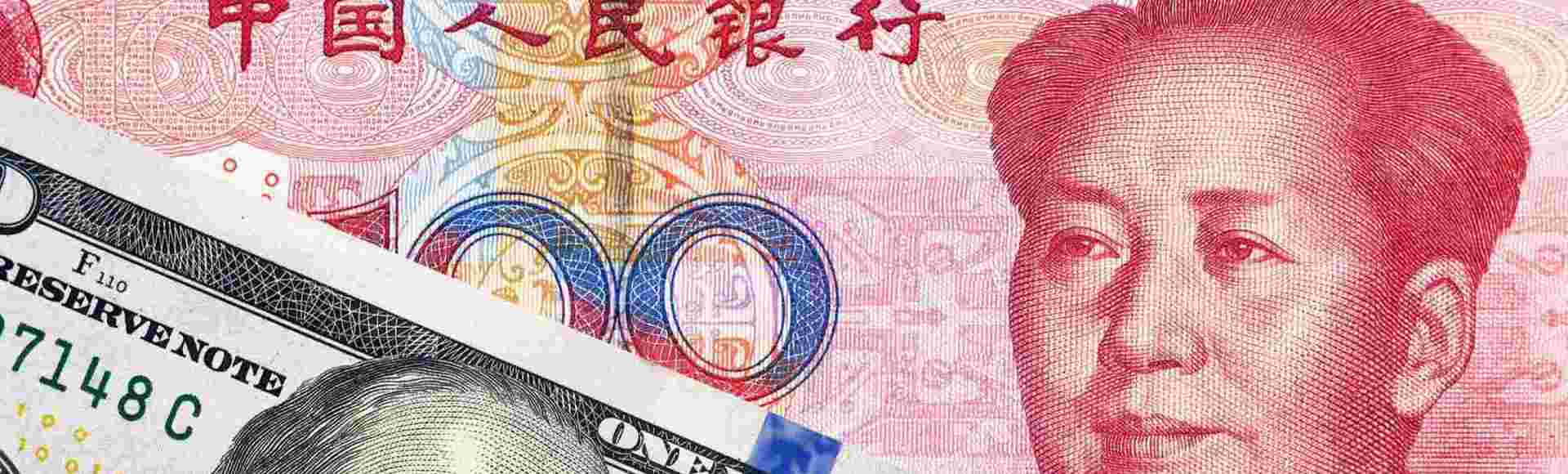 US dollar and Renminbi banknotes.