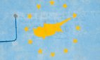 A community building in Protaras on the Eastern Mediterranean island of Cyprus shows a silhouette of the island within the stars of the EU flag.