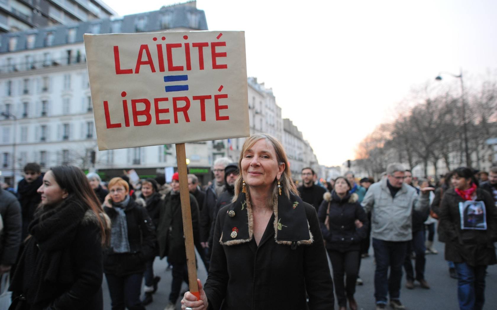 More than 1.5 million people take part in a march to support freedom of expression.