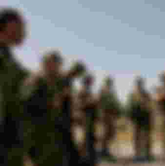 Russian soldiers receive instructions from their commander before entering the city Gori, during the Russo-Georgian War August 2008. Credit: Eddie Gerald / Alamy Stock Photo.