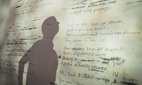 A projection of the original manuscript of the poem 'Toads' by Philip Larkin.
