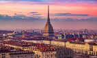 The skyline of Turin, Italy, at dusk.