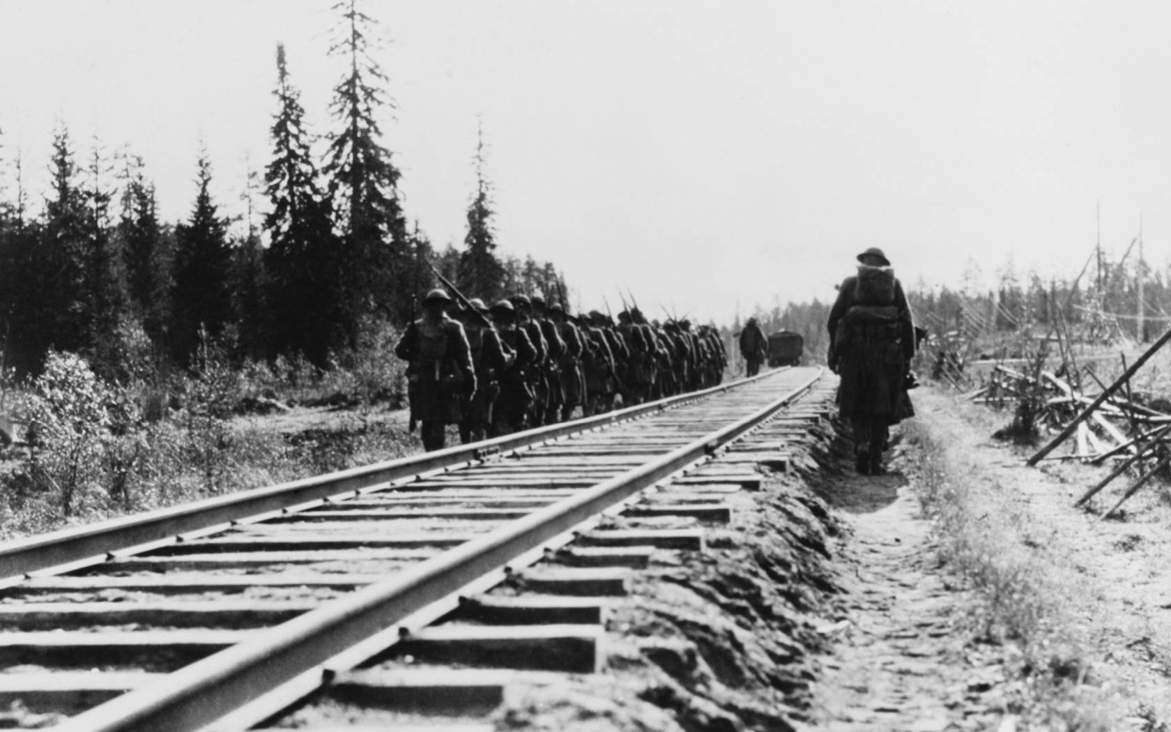 US Infantry marching along railway lines during the Russian Intervention, 1918-20.