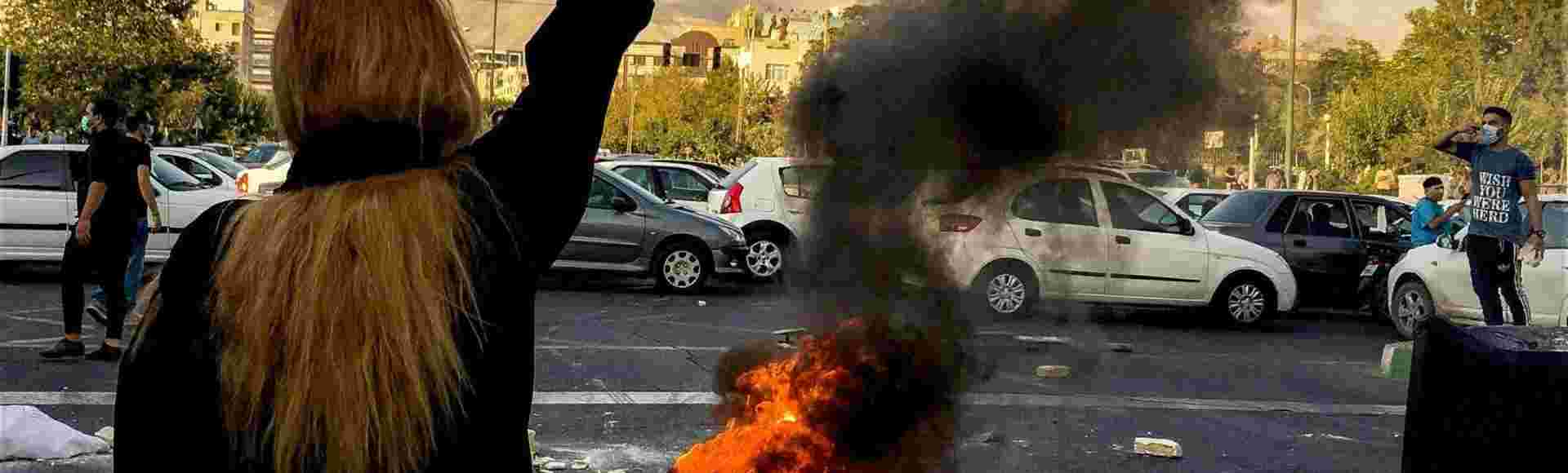 Iranians protesting against the death of 22-year-old Mahsa Amini after she was detained by the morality police, in Tehran, 1 October, 2022.