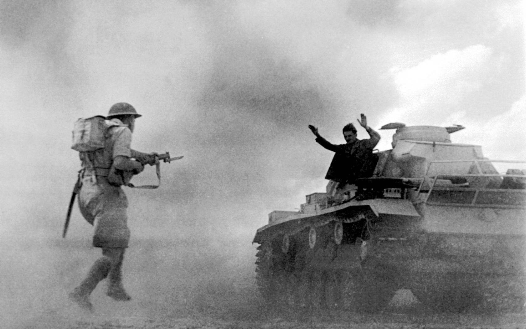 A German tank surrenders to British troops during the Battle of El Alamein, 1942.
